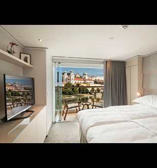 Grand Balcony suite with the window open in Europe